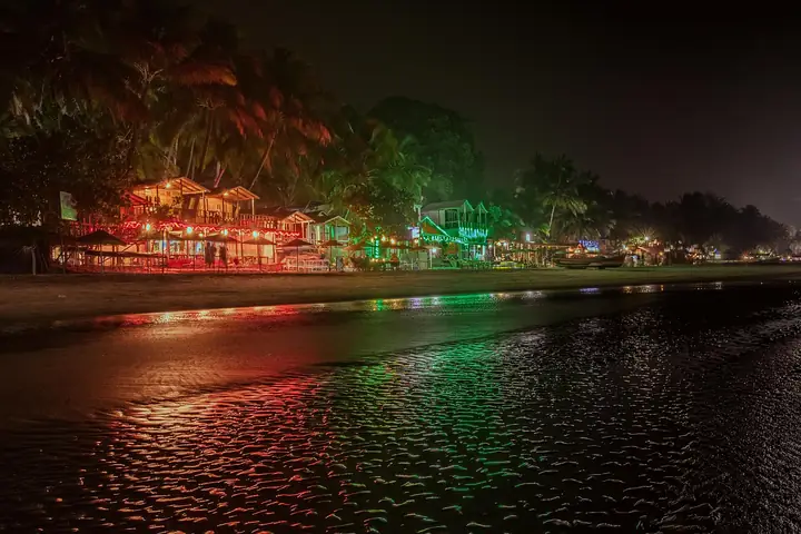 Beach shacks lit up at night on Palolem, Goa